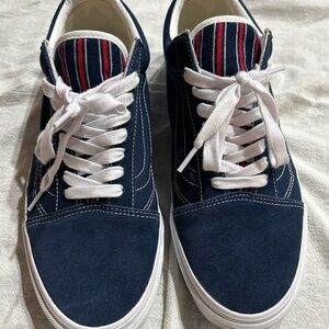 Vans Navy Blue Men's Sneakers with White Accents and red stripes.